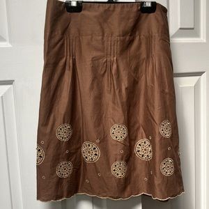 LOFT A-Line skirt. Brown w/Gold circles (wheels) w/open cutouts & wooden beads.